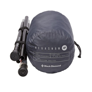 Black Diamond Mega Snow 4P expedition shelter packed in a grey storage bag with tent poles