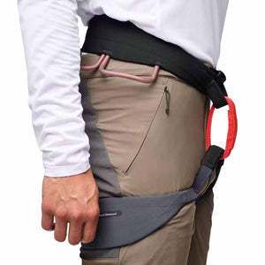 Black Diamond climbing harness worn over pants showing gear loops and haul loop