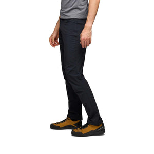 Black Diamond black trousers worn by a person from a side profile view