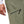 Close up of Black Diamond olive green hiking pants with zippered thigh pocket