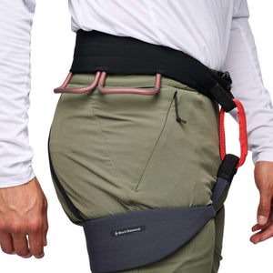 Black Diamond climbing harness worn over olive green pants