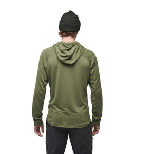 Back view of a person wearing a Black Diamond olive green long sleeve hooded shirt and a black beanie