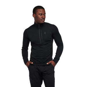 Man wearing a black Black Diamond long sleeve quarter zip base layer