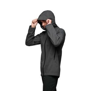 Person wearing a grey Black Diamond hooded shell jacket
