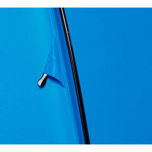Close up of blue tent fabric with black pole and attachment point