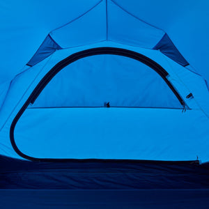 Interior view of a blue Black Diamond tent showing the zippered door and ceiling structure
