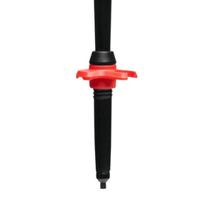 Black trekking pole tip with a red circular snow basket
