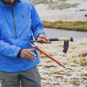 Person assembling a Black Diamond folding trekking pole