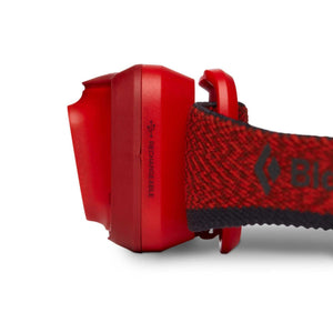 Side view of red Black Diamond rechargeable headlamp with elastic strap