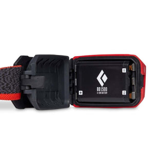 Black Diamond BD 1500 lithium ion battery inside an open headlamp battery compartment