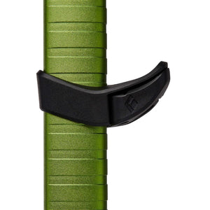Black Diamond adjustable flicklock mechanism on a green trekking pole shaft
