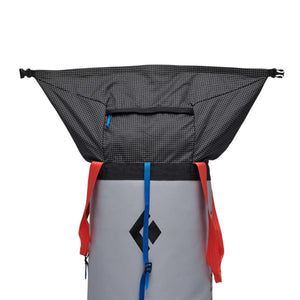 Black Diamond haul bag with open roll top closure and grey cylindrical body