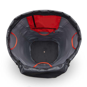 Interior view of a Black Diamond climbing rope bag with red gear loops and a zippered pocket