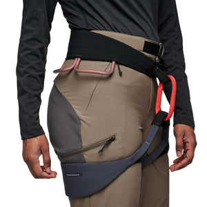 Black Diamond climbing harness worn over brown pants