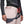 Black Diamond climbing harness worn over light pants