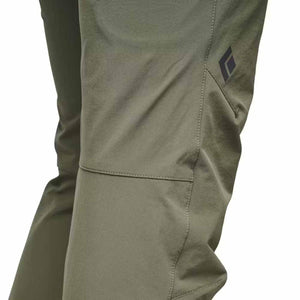 Olive green Black Diamond pants showing knee seam and logo