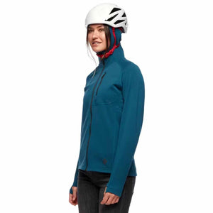 Woman wearing a blue Black Diamond hooded fleece jacket and a white climbing helmet