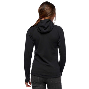 Back view of a woman wearing a black Black Diamond hooded long sleeve top