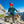 Climber wearing a Black Diamond helmet and jacket handling climbing ropes on a mountain ridge