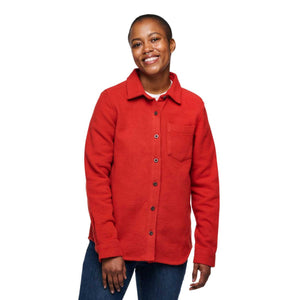 Person wearing a red button down fleece shirt with a chest pocket