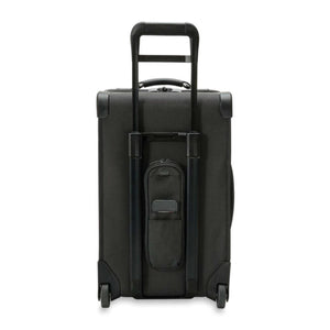 Back view of a black rolling suitcase with an extended telescopic handle