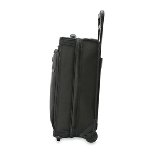 Black upright rolling suitcase with extended handle viewed from the side