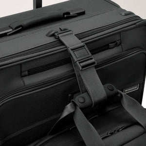 Briggs and Riley luggage strap securing a bag to a suitcase handle