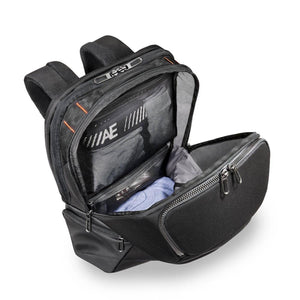 Open Briggs and Riley black backpack with interior mesh pockets and clothing