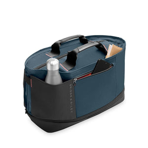 Blue Briggs and Riley travel bag with black handles and external pockets containing a water bottle and phone