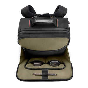 Open black backpack with olive green interior pockets containing a pen and small electronic accessories