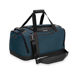 Blue Briggs and Riley duffel bag with black trim and shoulder strap