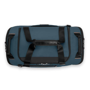 Blue Briggs and Riley duffel bag with black handles and zippered compartments