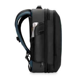 Side profile of a black Briggs and Riley backpack with a water bottle in the side pocket