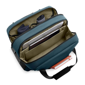 Open Briggs and Riley blue laptop bag with internal compartments holding a laptop and accessories