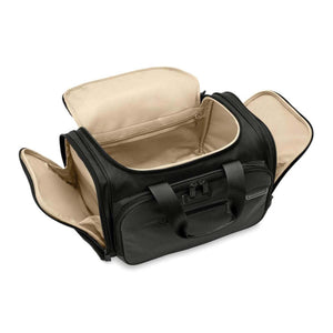 Open black Briggs and Riley duffel bag with beige interior lining