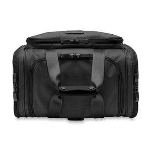 Black Briggs and Riley travel duffel bag with top handles and zippered compartments