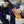 Person holding Hothands insole foot warmers package and black insole