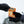 Two gloved hands holding a Hothands hand warmer packet