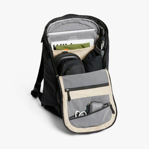 Open Bellroy backpack showing internal organization pockets with laptop and accessories