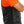 Side view of a person wearing a black vest over an orange t-shirt