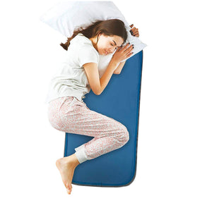 Person sleeping on a Cool Care Technologies blue cooling mat