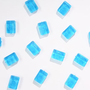 Cool Links blue translucent rectangular plastic connectors scattered on white background
