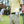 Cool On The Go personal fan clipped to a golfers waistband on a golf course
