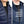 Two close up views of a 30seven thin navy blue jacket worn under other clothing