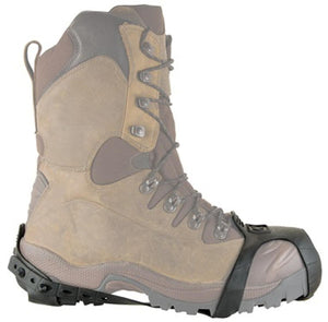 Black rubber ice traction cleat attached to a tan hiking boot
