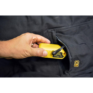 Hand placing a yellow DeWalt USB power source into a black jacket pocket