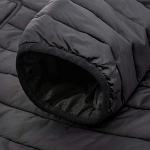 Close up of black quilted jacket sleeve cuff with fleece lining