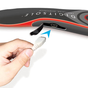 Hand plugging a micro USB cable into a Digitsole smart insole
