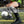 Soccer player wearing a black DonJoy ankle brace over a sock on a field