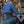 Man wearing a DonJoy back brace in a warehouse